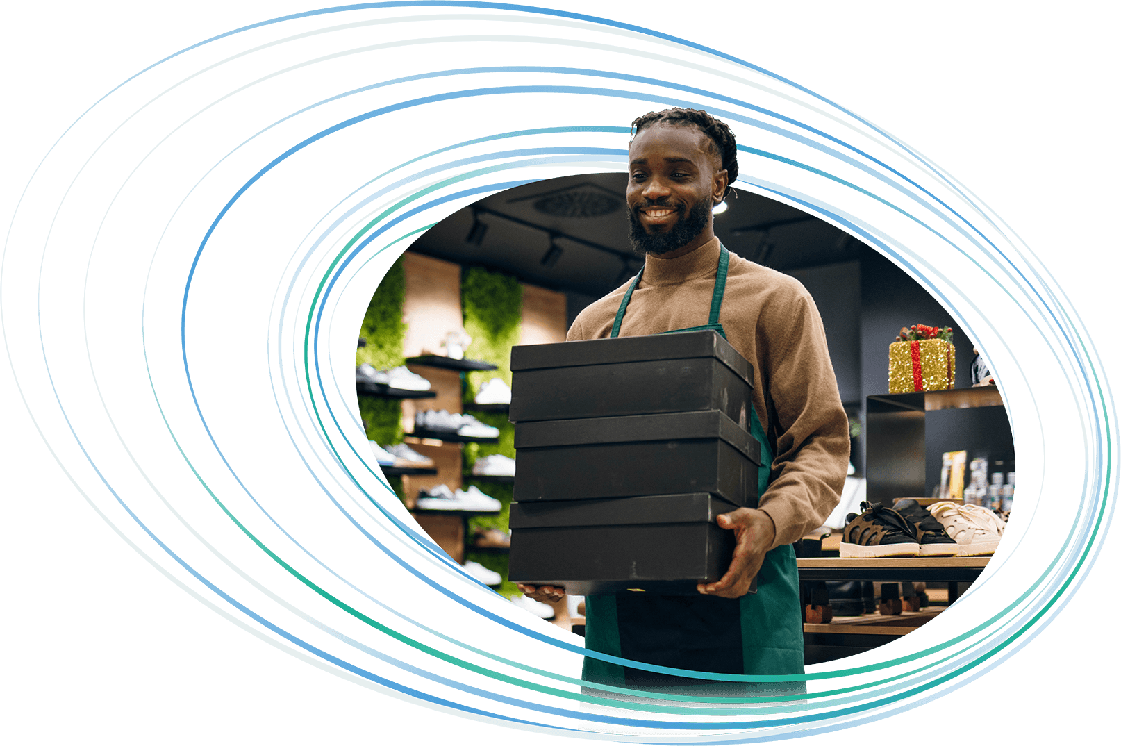 A retail worker holding shoe boxes